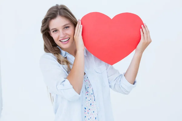 Woman holding heart card — Stock Photo, Image