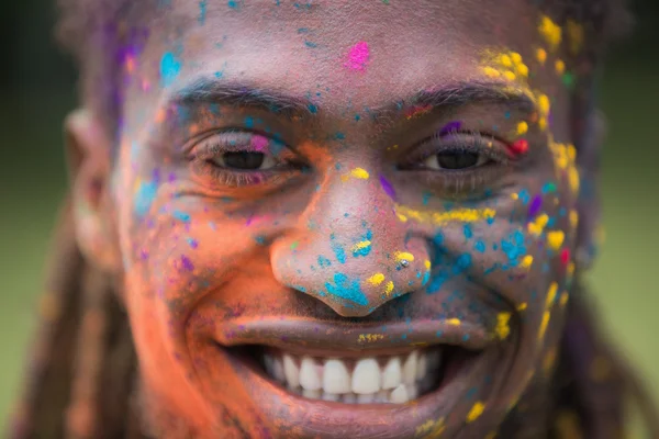 Hipster covered in powder paint