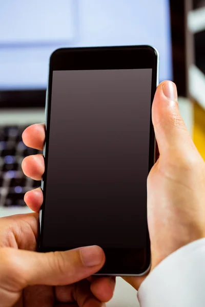 Man using laptop and smartphone — Stock Photo, Image