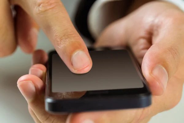 Geschäftsmann mit seinem Smartphone — Stockfoto