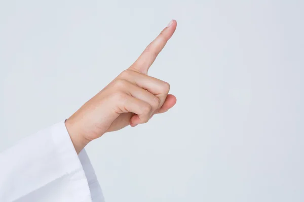 Doctor pointing the finger in the air — Stock Photo, Image