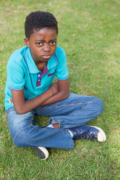 Sad little boy in the park — Stock Photo, Image