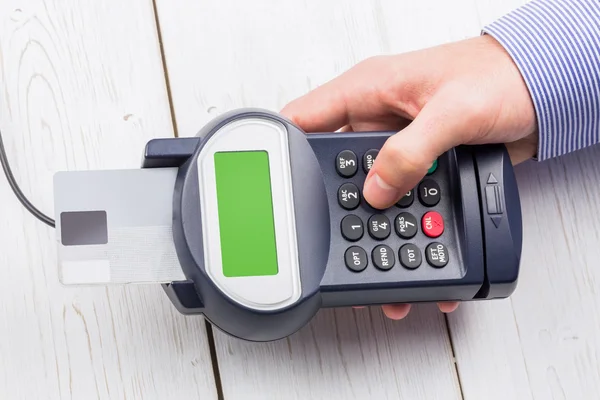 Man entering his pin on terminal — Stock Photo, Image