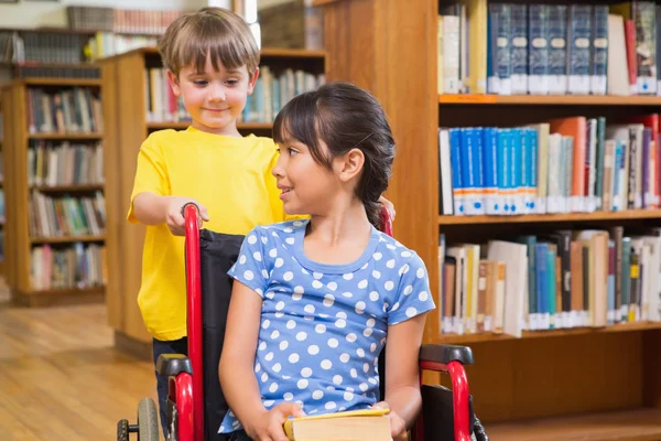 Cute pupils at the library — Stock Photo, Image
