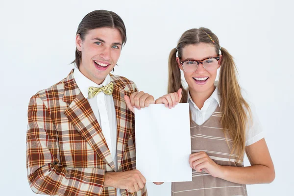 Geeky hipsters holding a poster — Stock Photo, Image
