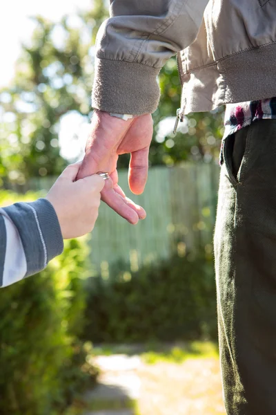 Father and son holding hands — Stock Photo, Image