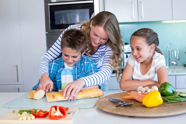 Happy family preparing lunch together — Stock Photo, Image