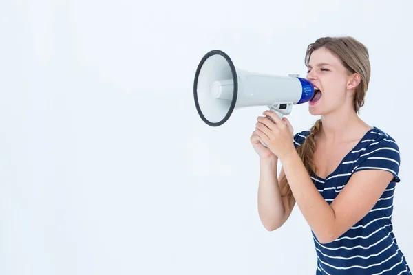Woman shouting through a loudspeaker Royalty Free Stock Images