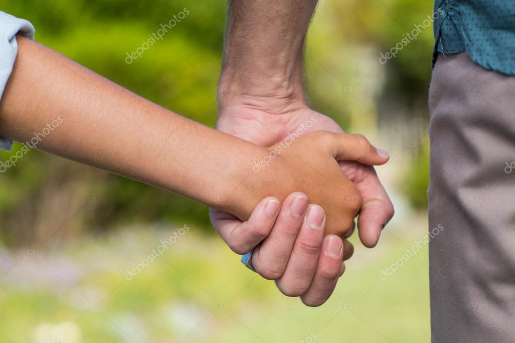 Father and son holding hands — Stock Photo © Wavebreakmedia 73267155