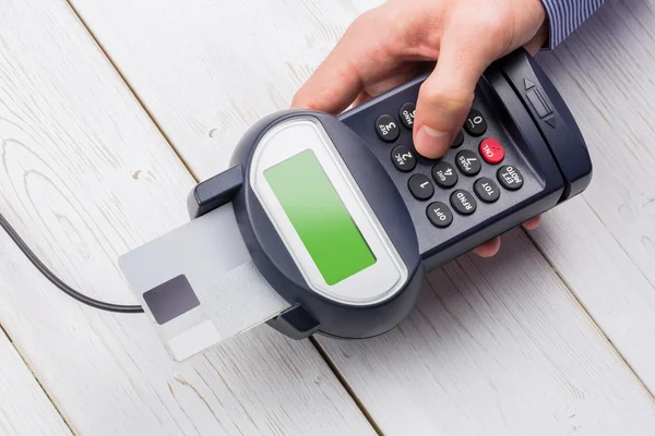 Man entering his pin on terminal — Stock Photo, Image