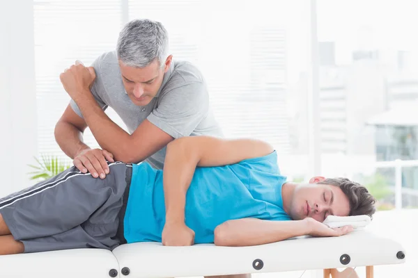 Doctor examining his patient pelvis — Stock Photo, Image