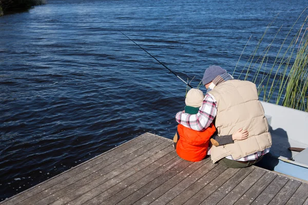 Happy man fishing with his son — Stock Photo, Image