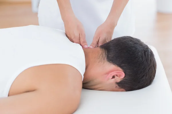 Physiotherapist doing neck massage — Stock Photo, Image