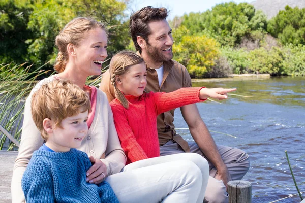 Happy family at a lake — Stock Photo, Image