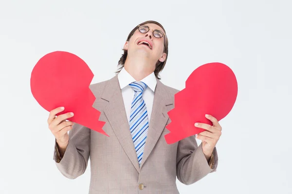 Geeky businessman holding broken heart — Stock Photo, Image