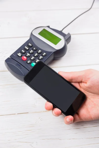 Man using smartphone to express pay — Stock Photo, Image