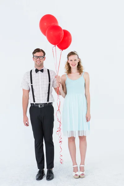 Geeky hipster couple hands in hands looking at camera — Stock Photo, Image