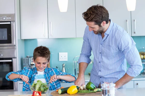 Happy family preparing lunch together — Stock Photo, Image