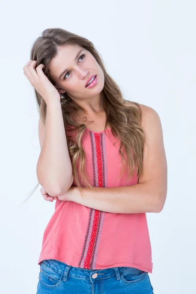 Thoughtful woman with hand on her hair — Stock Photo, Image