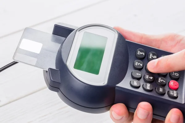 Man entering his pin on terminal — Stock Photo, Image