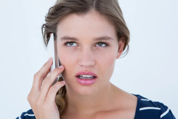 Unsmiling woman calling with her smartphone — Stock Photo, Image