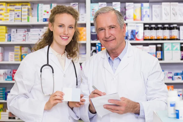 Pharmacist looking a medication for a prescription — Stock Photo, Image