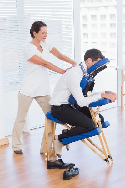 Businessman having back massage — Stock Photo, Image