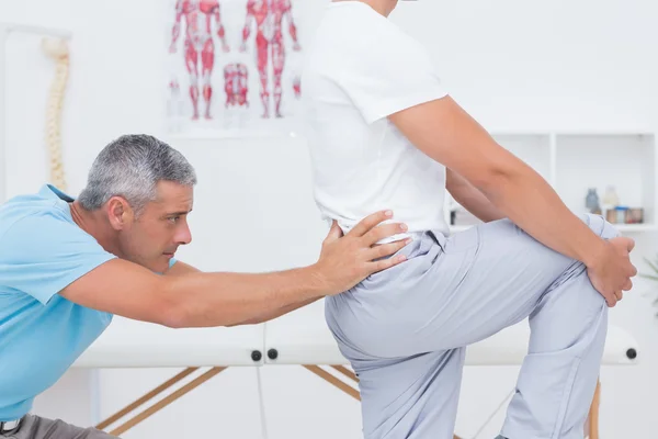 Doctor examining his patient back — Stock Photo, Image