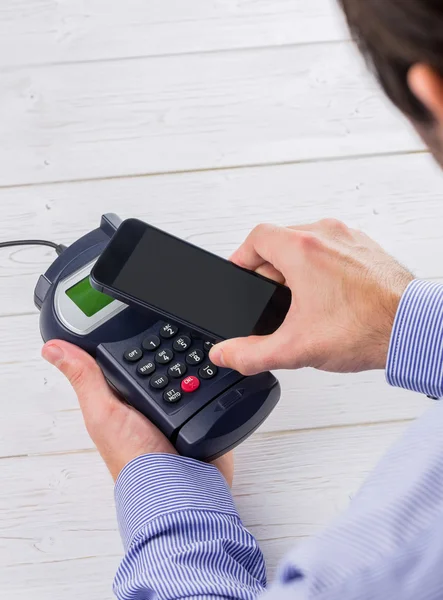 Man using smartphone to express pay — Stock Photo, Image