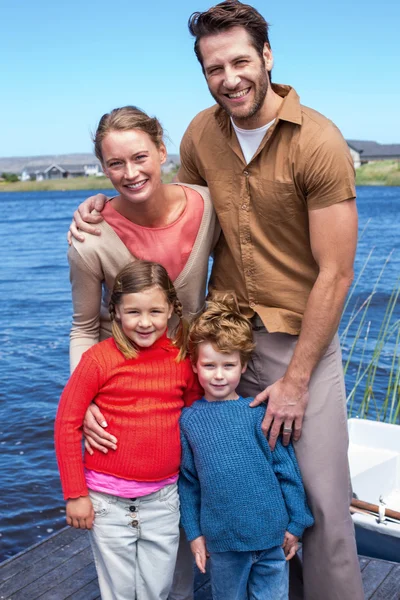 Happy family at a lake — Stock Photo, Image