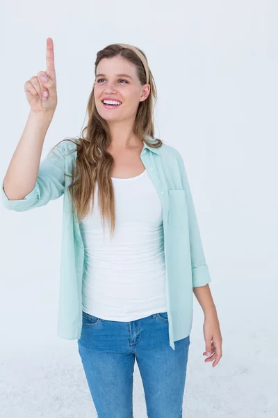 Pretty hipster pointing with her finger — Stock Photo, Image