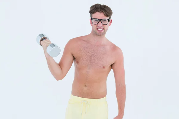 Geeky hipster posing topless with dumbbell — Stock Photo, Image
