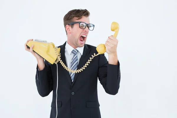 Businessman shouting at telephone — Stock Photo, Image