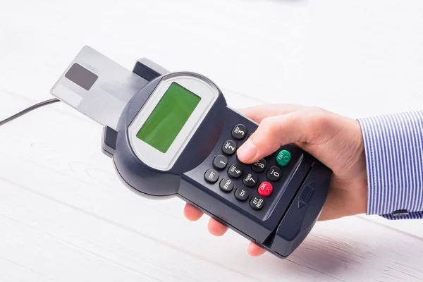 Man entering his pin on terminal — Stock Photo, Image