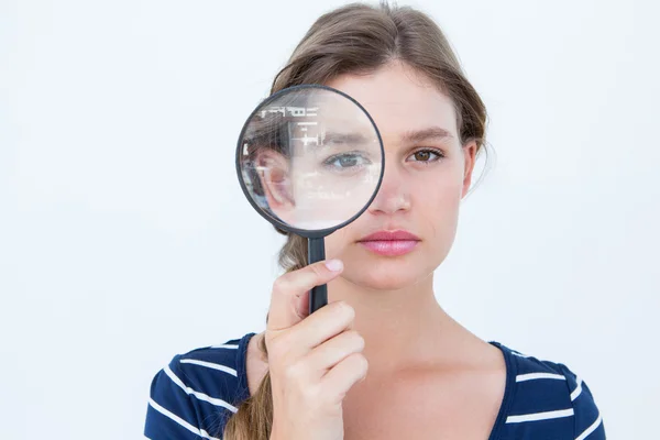 Woman holding magnifying glass — Stock Photo, Image