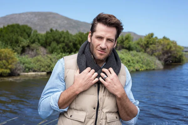 Handsome casual man at a lake — Stock Photo, Image