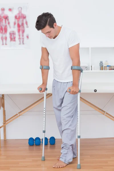 Patient walking with crutch — Stock Photo, Image