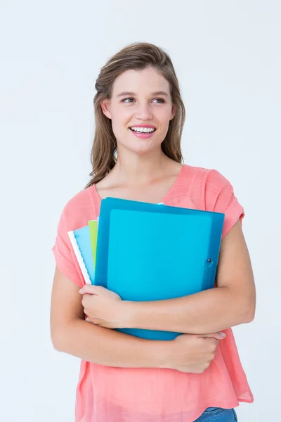 Smiling hipster holding notebook — Stock Photo, Image