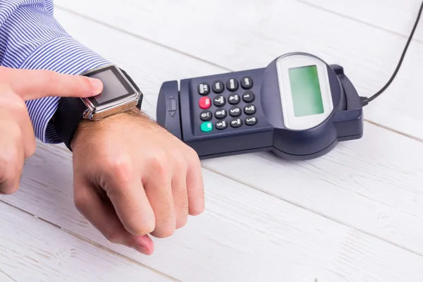 Man using smart watch to express pay — Stock Photo, Image