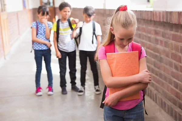 Pupils friends teasing a pupil alone — Stock Photo, Image