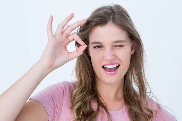 Pretty woman gesturing ok sign — Stock Photo, Image
