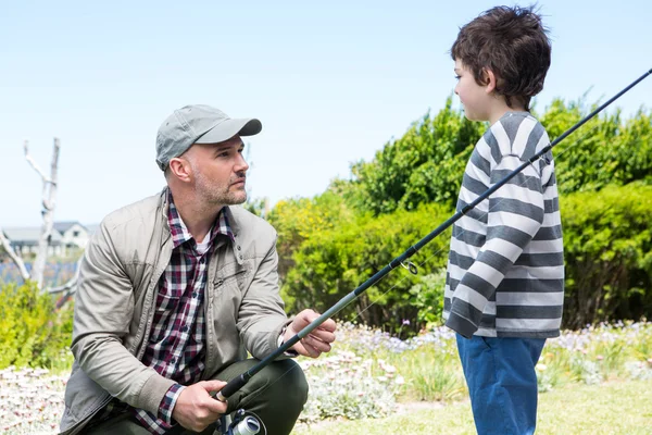 Father and son fishing together — Stock Photo, Image