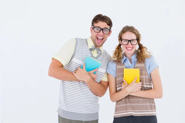 Geeky hipster couple holding books — Stock Photo, Image