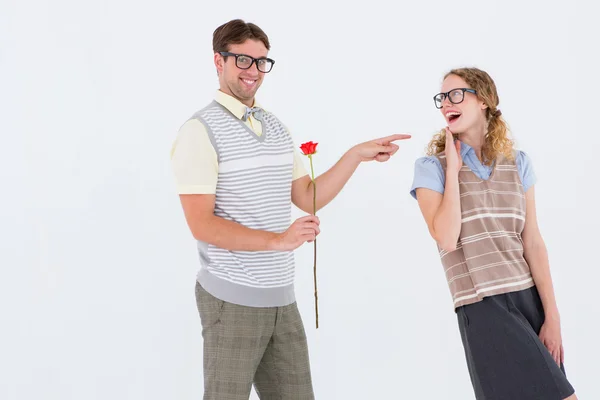 Geeky hipster holding rose — Stock Photo, Image