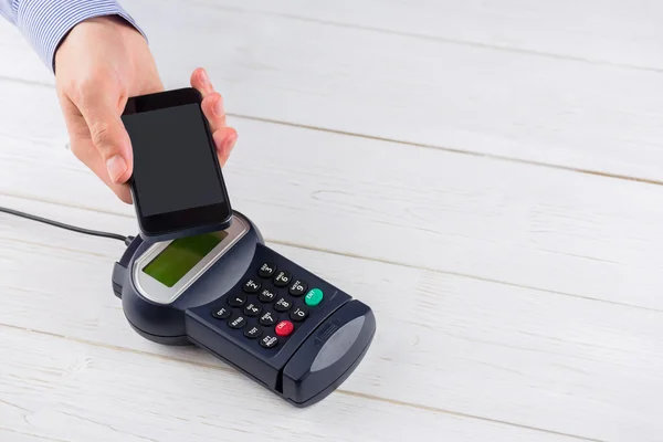 Man using smartphone to express pay — Stock Photo, Image