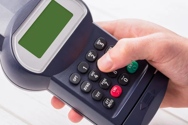 Man entering his pin on terminal — Stock Photo, Image