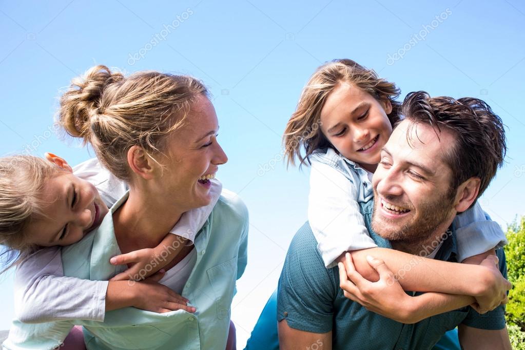 depositphotos_73276531-stock-photo-happy-parents-with-their-children.jpg