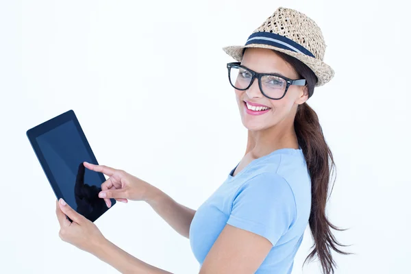 Smiling woman using her tablet looking at camera — Stock Photo, Image
