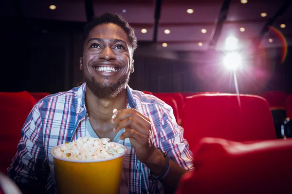 Young man watching a film — Stock Photo, Image