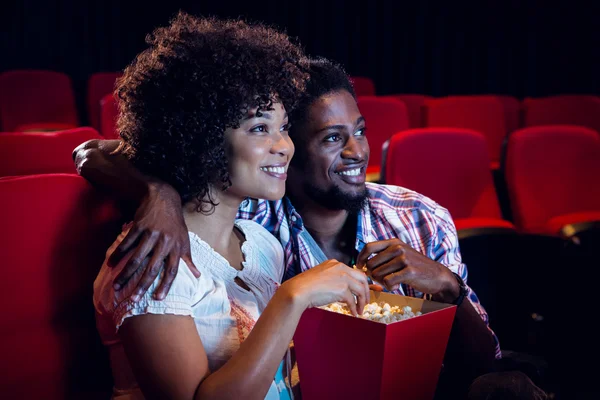 Happy young couple watching a film — Stock Photo, Image